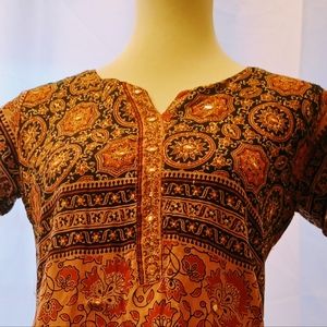 Vintage Indian suit. Copper tones with small mirrors throughout.